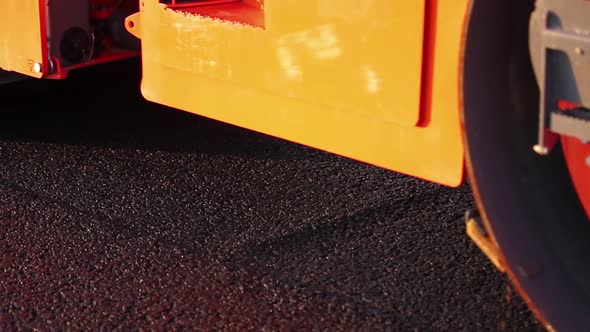 The Paver Mover on a Flat Newly Made Road, Ramming and Leveling. Asphalt Paver Applying Asphalt on alt