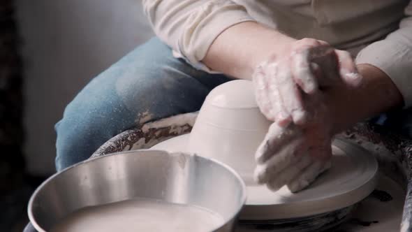 Manufacture Master Working with Clay in Pottery Studio