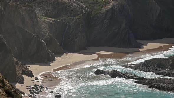 Sandy Beach and Cliff Rocks on Atlantic Coast alt