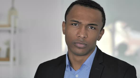 No, Casual Afro-American Businessman in Bad Mood Disliking Offer By Shaking Head alt