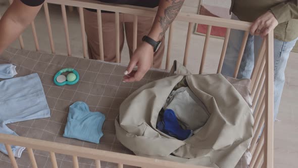 Lesbian Couple Packing Bag for Maternity Hospital alt