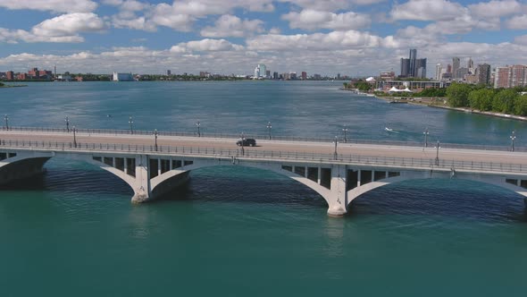 Establishing shot of the Douglas MacArthur Bridge over the Detroit river. This video was filmed in 4 alt