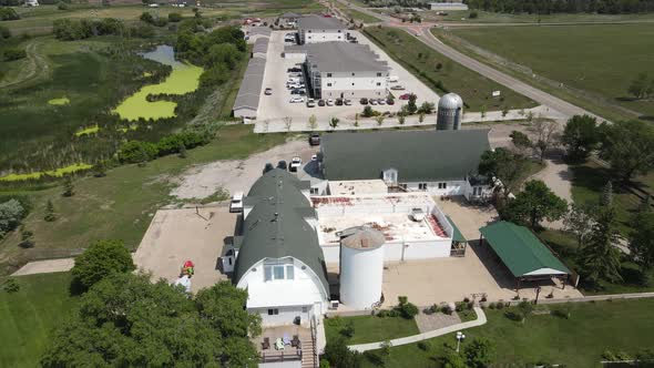 Aerial view of a white building with a gray roof in Bismarck on a sunny day