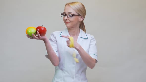 Nutritionist Doctor Healthy Lifestyle Concept - Holding Fresh Natural Organic Fruits alt