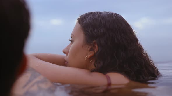 Beautiful Female Dipped in Water With the Relaxing View of the Blue Skies alt