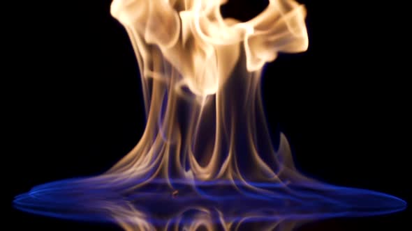 Falling Match Causes Flames to Ignite Against Black Studio Background alt