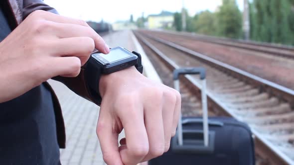 Woman Using Smart Watches At The Station alt