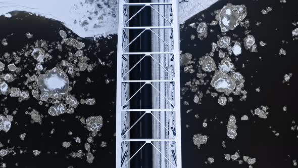 River with floe and bridge. Aerial view of winter, Poland alt