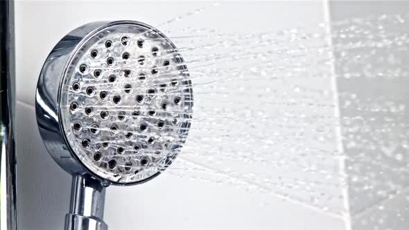 A Stream of Water Pours From the Shower Head alt