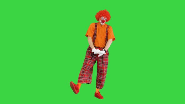 Male Clown Yawning Stitching and Doing Some Exercise in the Morning on a Green Screen Chroma Key alt