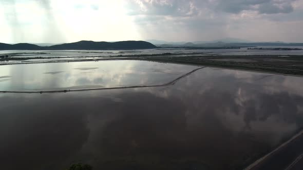 Alykes the Hellenic saltworks located outside of Mesolongi in Greece. Drone footage with the clouds alt