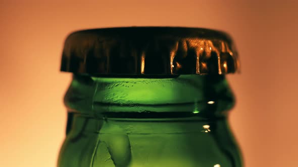 Closed Beer Bottle Close-up on a Light Background.