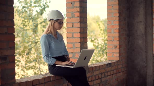 Civil Engineer Checking Construction Site. Woman Architect In Helmet Inspecting Building. Designer alt
