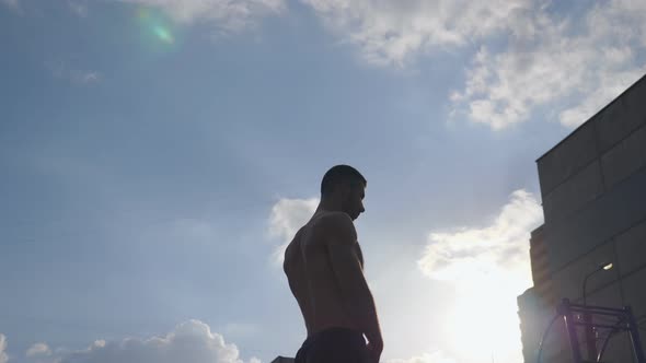 Young Athlete Warming Up Neck Before Intense Training at Sports Ground alt
