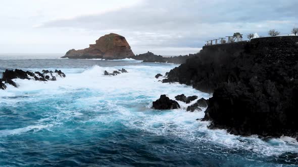 Drone Flying Low Over Waves and Cliffs at Porto Moniz, Madeira island, Portugal
