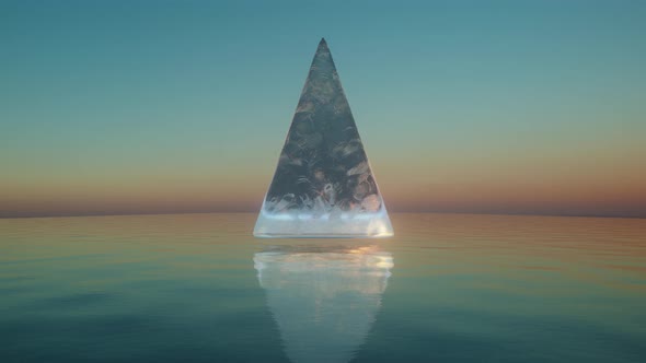 Ice Pyramid Rotating Over Calm Ocean Waters Loop