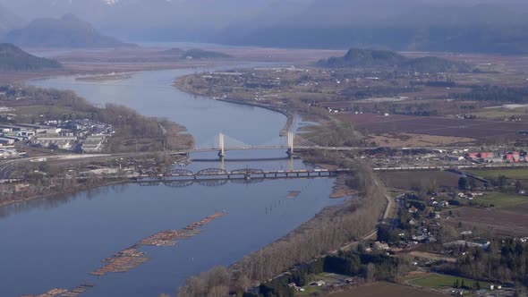 Aerial View Of Pitt River Bridge And Canadian Pacific Railway Spanning Between Port Coquitlam And Pi, Stock Footage