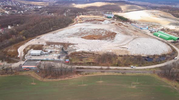 Aerial drone view of stack of different types of large mountain garbage pile alt