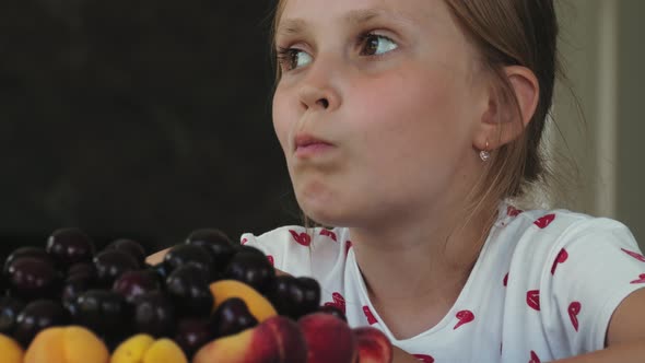 Child Eats Summer Juicy Fruits