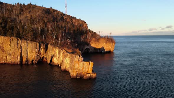 wonderful landscape aerial view during golden hour in lake superior north shore, rocky cliffs visit alt