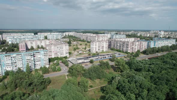 Aerial View MultiStorey Buildings Near Green Forest in Residential Area at City alt