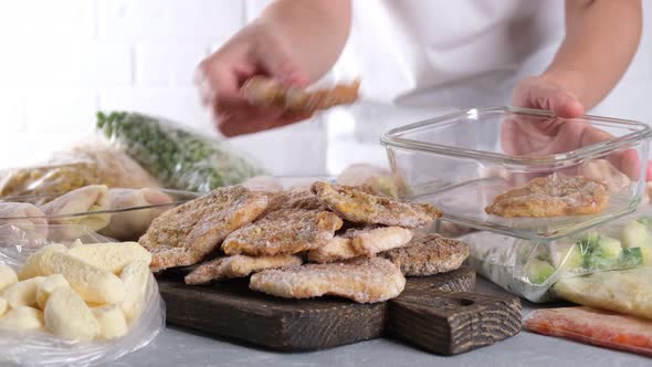 Frozen food. Frozen pork neck chops meat and pork schnitzel on the table