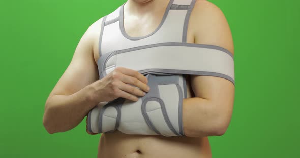 Man Shoulder Injury. Bandage for Fixing of an Elbow Joint and a Humeral Belt alt