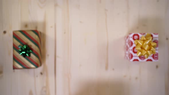 Hands putting a gift box alt