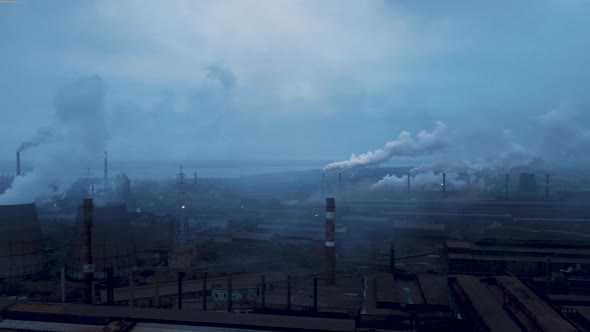 Heavy industry, billowing pollution into a blue sky, poor environment in the city, environmental alt
