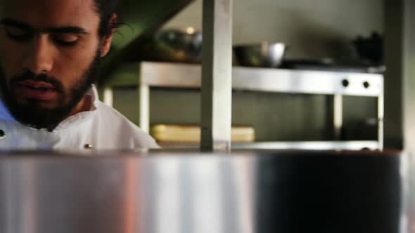 Chef working in kitchen alt