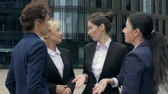 Four Business Women Colleagues Happy Talking About Startup Investing, Boss Joking Female Employee