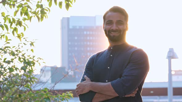 Smiling Rich Indian Business Man Looking at Camera Outdoor on Sunset Portrait alt