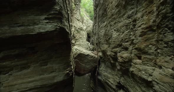 The camera rising down over the hill and waterfall. shot of the small waterfall