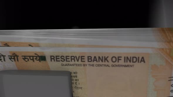 200 Indian rupees  in cash dispenser. Withdrawal of cash from an ATM. alt