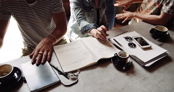 Slow motion shot of students during meeting in a cafe alt