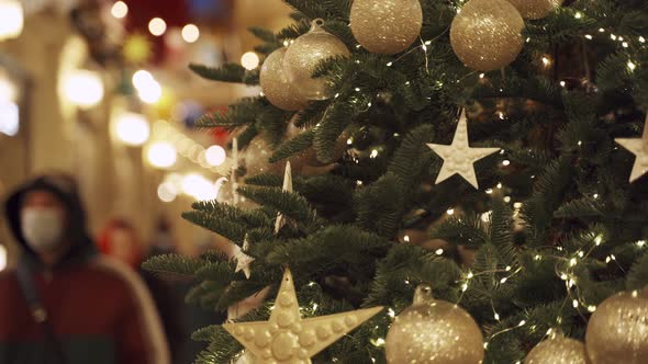 Christmas Tree with Golden Decorations on Street