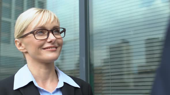 Cheerful Male and Female Colleagues Having Chat Outside Office Building, Affair