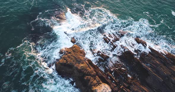 Aerial view of the edge of the rocky shore of Curtis island lighthouse Camden Maine USA alt