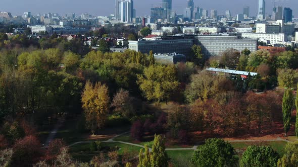 Urban green place unveiling Warsaw city skyline with gigantic stock buildings, nature meets modern l alt