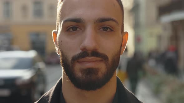 Close Up Portrait of Confident Muslim Man Posing on Street alt