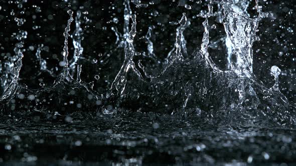 Super Slow Motion Shot of Linear Water Splash at 1000Fps Isolated on Black Background alt