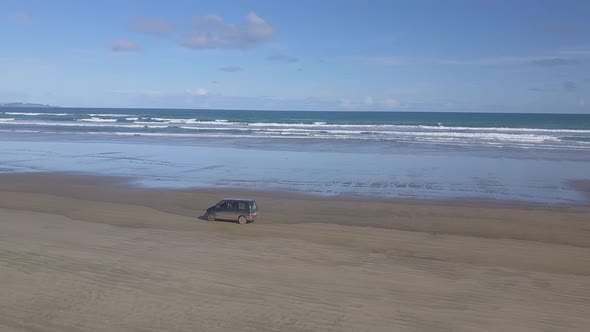 Aerial footage of driving on the beach