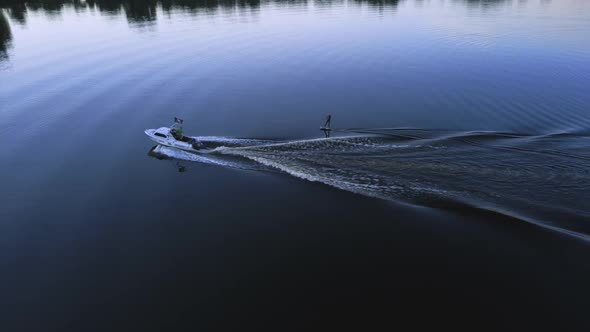 Aerial Photography Wakeboarding Wakeboarding After a Boat at Sunset Top View and an Athlete Falling