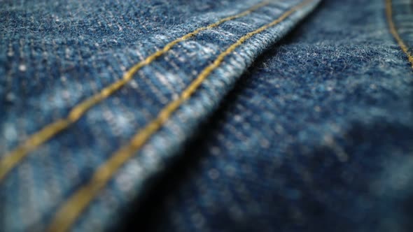 Extreme Detailed of Blue Denim Jeans Texture in Dolly Shot Over Cloth Surface alt