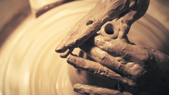 Hands of Woman Working on a Pottery Wheel. Creating a Ceramic Pot
