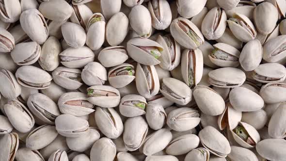 Close-up of salted unpeeled pistachios for beer