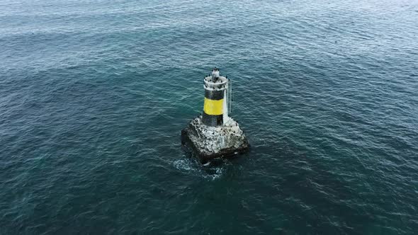 Aerial view of lighthouse in the sea	