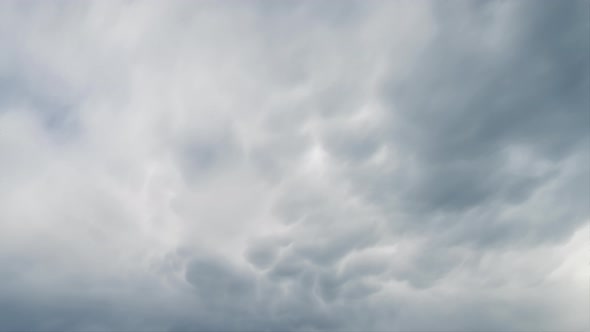 Timelapse Close up of white and gray clouds high in the blue sky. Cloudy weather