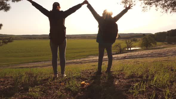 Girl Traveler with a Teen Girl Travel at Sunset alt
