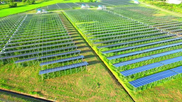 Aerial shot of Solar Power Station at morning. 4k drone footage. alt